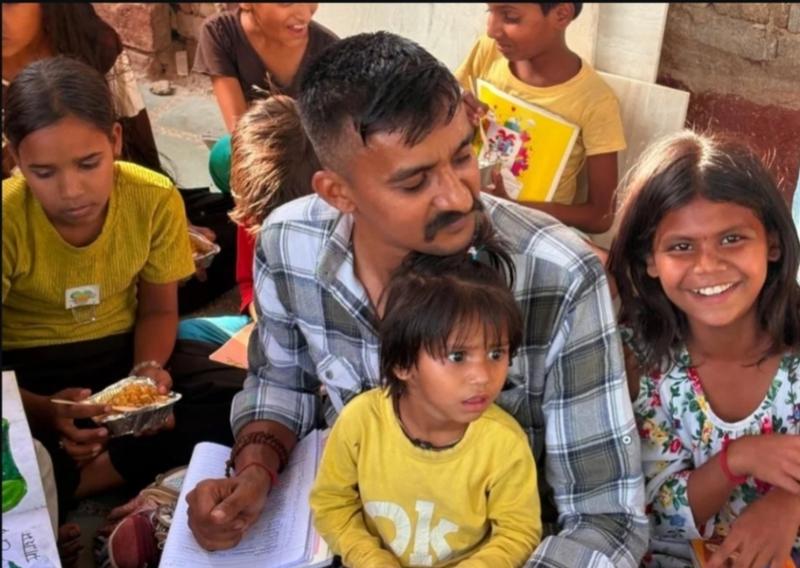 Volunteers engaging with children
